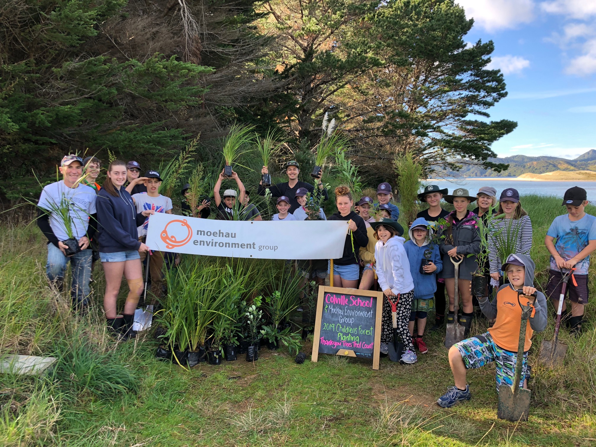 A group of children from the Coromandel Area School explore  Waikawau Bay Wetland 